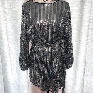 Silver sequin long sleeve mini dress with waist wrap.